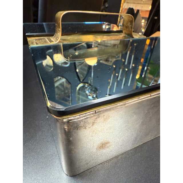 This elegant vanity/storage box showcases a striking blend of materials and craftsmanship. Featuring a polished brass...