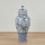 Impressive pair of Chinese blue and white porcelain palace urns featuring an elegant baluster form richly decorated with...