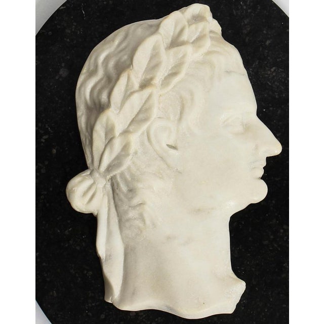 This is a beautiful Italian white Carrara marble profile bust of the Roman Emperor Claudius, dating from the mid-19th...