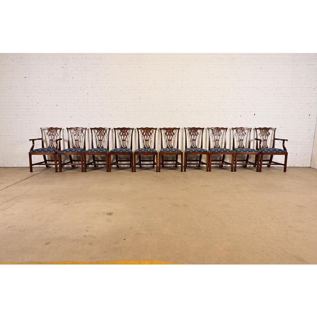 A gorgeous set of ten Georgian or Chippendale style dining chairs In the manner of Baker Furniture USA, Circa 1980s Solid...