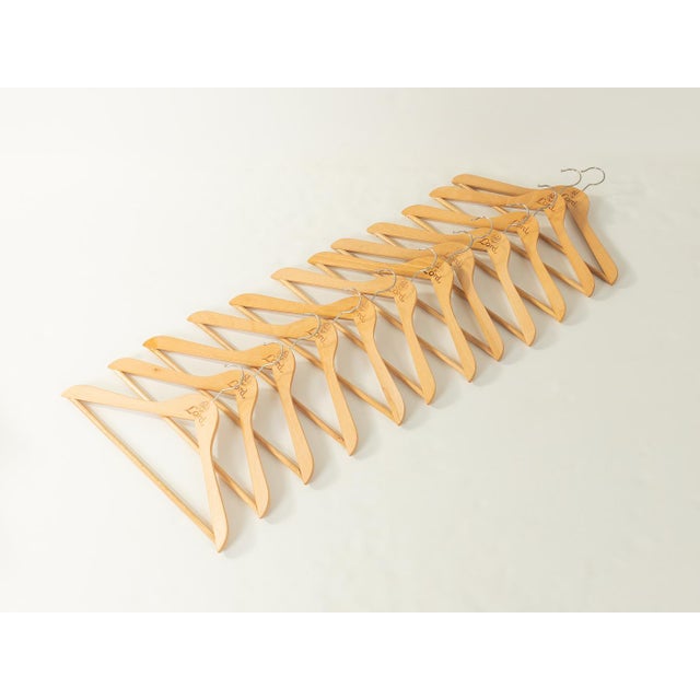 Unique 12-piece set of beechwood clothes hangers by RuWe for Lord, dating from the 1960s. Quality features: Excellent...