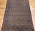 "A finely hand-knotted vintage Persian Qum area rug from the early 1900s featuring an exquisite allover paisley pattern on...