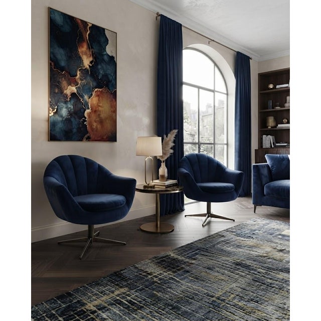 A stylish and matching pair of fully refurbished mid-century modern swivel lounge armchairs, featuring a distinctive...