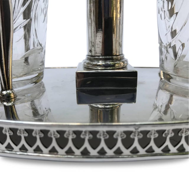 Brescian Silver Oil Cruet, 1812/1872. The cruet's stem, with two bottle holders supported by three stylized leaves, rests...