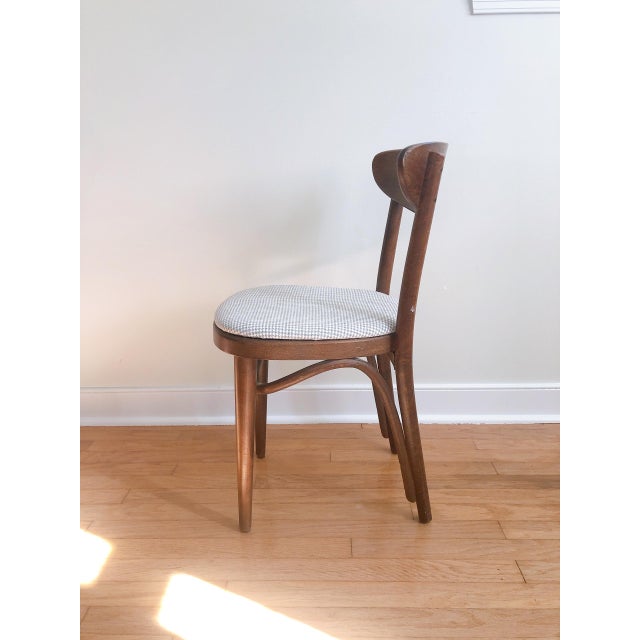 Stylish 1950's-1960's Thonet! This Bentwood chair in a darker stain is reupholstered with a grey white houndstooth fabric....