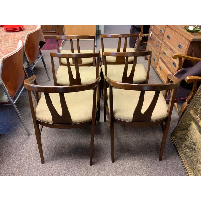 Mid Century Modern, vintage wishbone dining chairs. Set of six, four short arms, two long arms. Made by the respected...