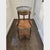 Elegant vintage - mid 20th Century French Louis XVI–style bouillotte table featuring a circular grey marble top set within...
