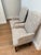 Beautiful upholstered accent armchairs in a versatile neutral beige and taupe tone with a hit of blue accent. These two...