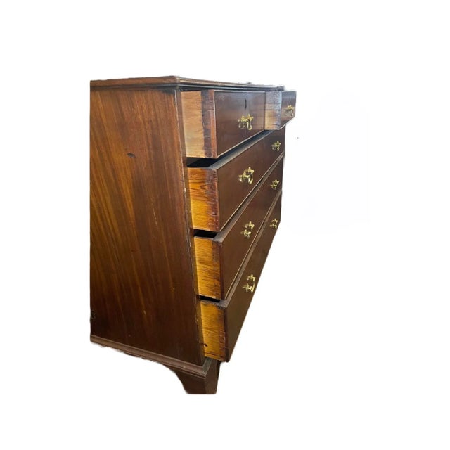 Mahogany chest that has 2/3 drawers. An English piece from the 21st century.