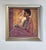 This oil on canvas panel presents a contemplative figure seated against a textured backdrop of warm hues. The interplay of...