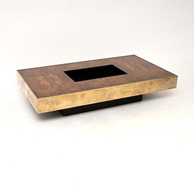 A stylish and very well made vintage French walnut and brass coffee table. This was recently imported from France, it...