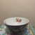 This striking Asian-inspired bowl features a dramatic deep midnight black finish, serving as a bold backdrop for...