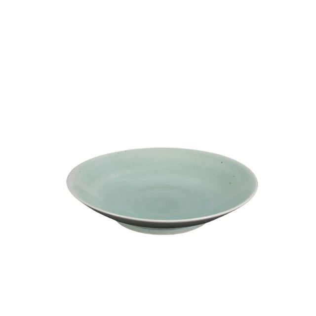 This large celadon plate is handmade and each has its own natural variance. Its classic celadon green color is a hallmark...