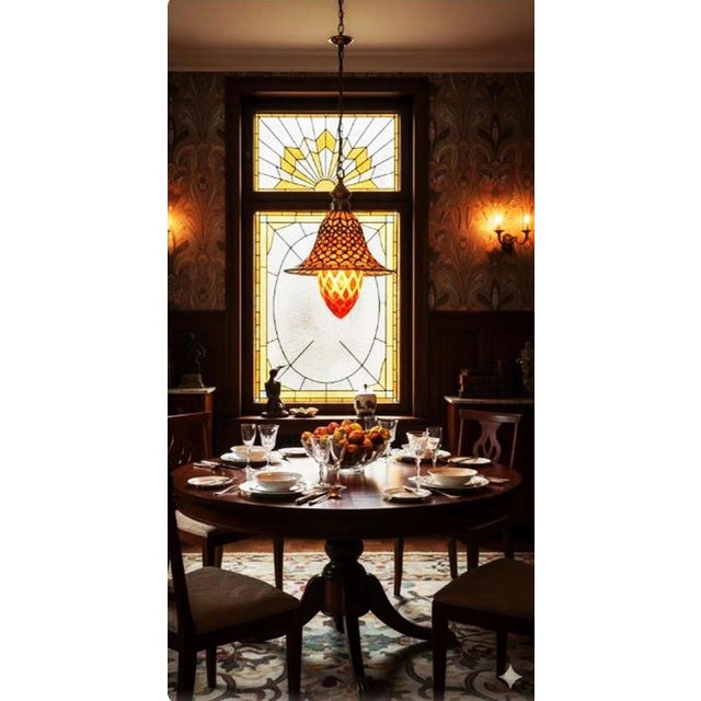 A striking and highly decorative 1940s Art Deco stained glass pendant light, distinguished by its unusual acorn-shaped...