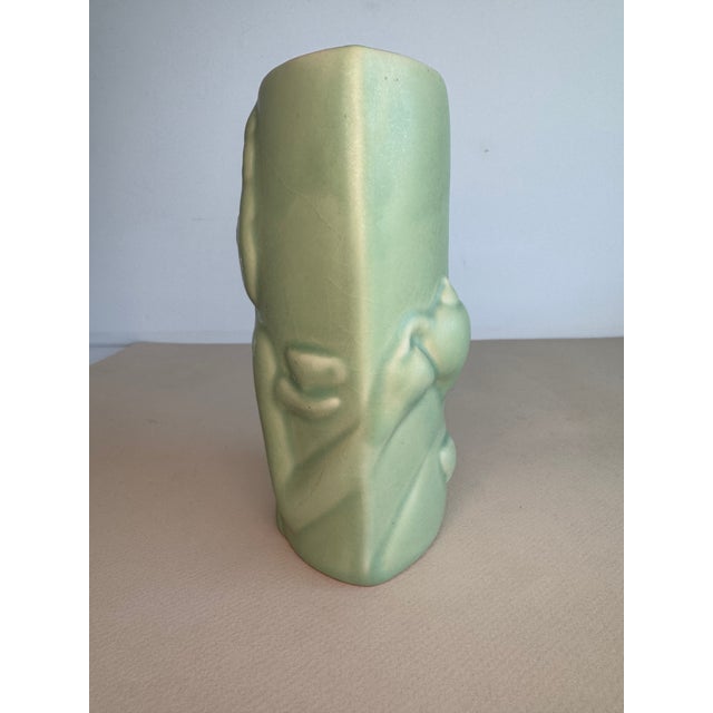 A vase by ceramic artist Donna Polseno. b.1950 An artfully designed vase with the image wrapping around the form. This is...