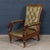 A handsome late Victorian reclining armchair, produced in England in the late 19th century, combining robust craftsmanship...