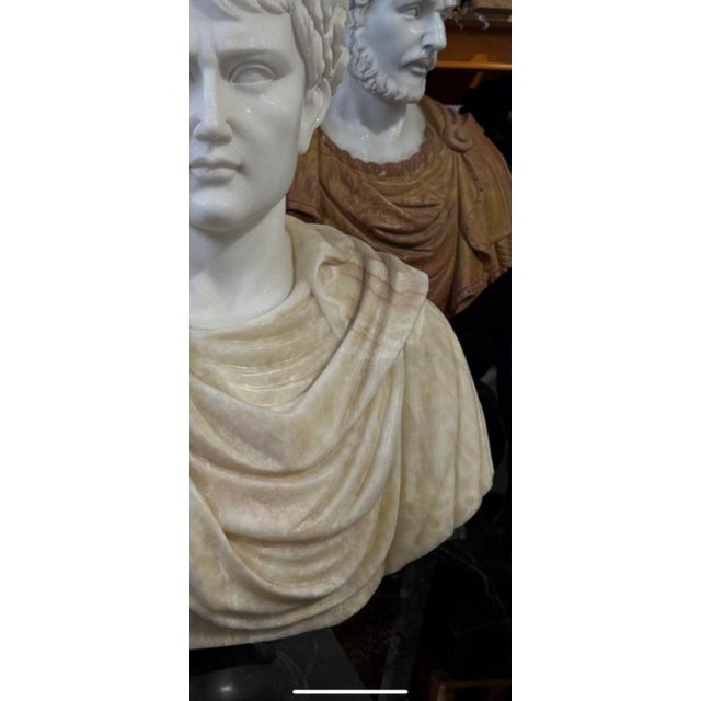 A stunning bicolored marble bust, skillfully crafted from a combination of white and beige marble, creating a refined and...