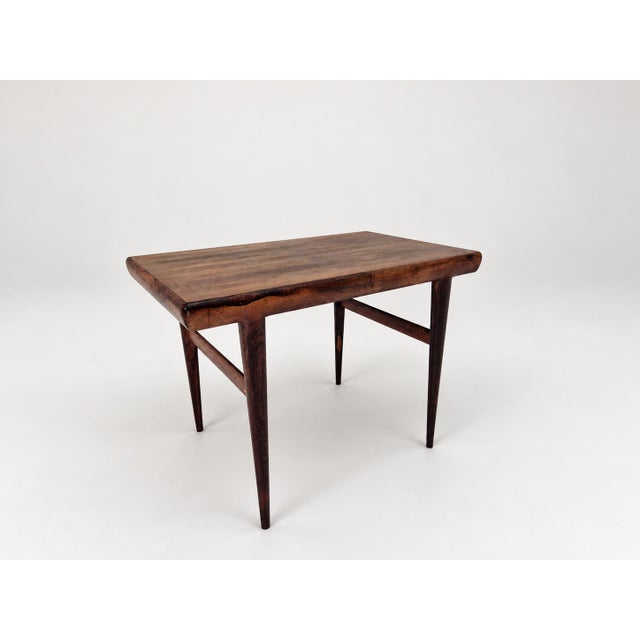 This is a side table designed by Johannes Andersen and produced by CFC Silkeborg in Denmark during the 1960s. The piece is...