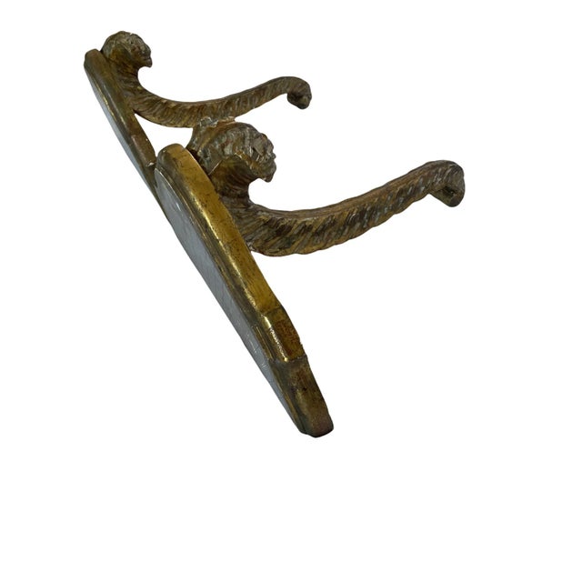 Painted wooden console, 1950 Italian work, silver above and gilded on the carved foot.