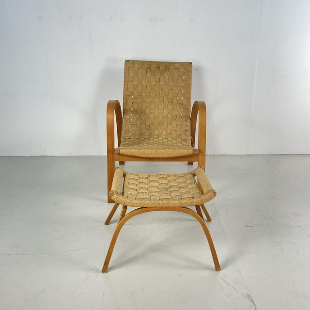 Mid Century Italian wood and chord lounge chair with ottoman purchased on a recent buying trip to Italy. In good vintage...