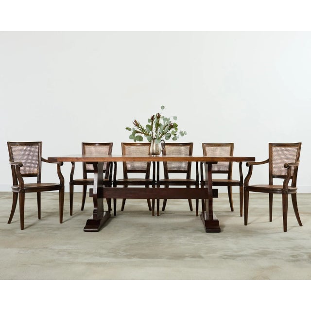 Handsome country English style fruitwood dining table hand-crafted by American artisans. The table features a 2 inch thick...