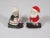 Vintage set of hand painted Santa and Mrs. Claus salt and pepper shakers on skies. Add these festive shakers to you...
