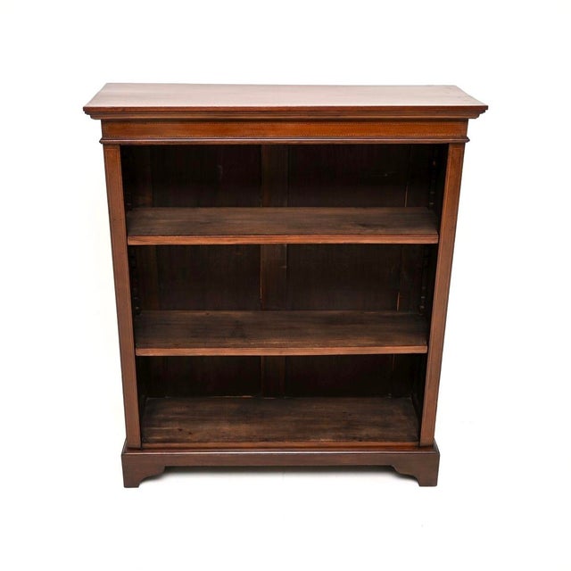 A very smart and well made antique Edwardian inlaid open bookcase. This was made in England, it dates from around the...