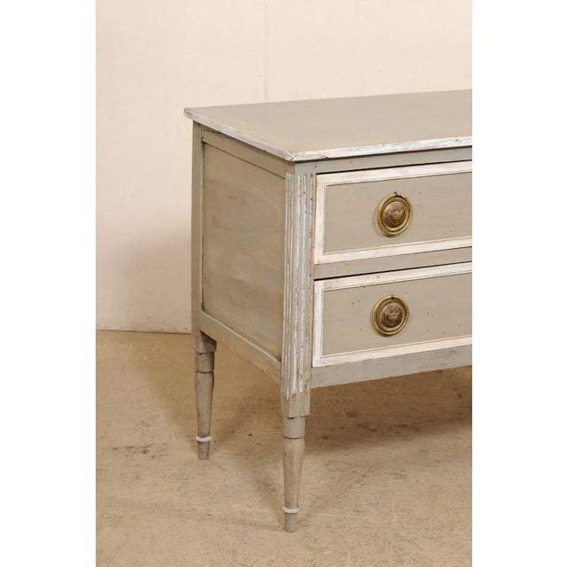 An Italian raised two-drawer chest from the turn of the 18th and 19th century. This antique chest from Italy features a...