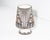 A footed vase by the Acoma Pueblo pottery D. Trujillo. The vase features an black and orange design against a white...