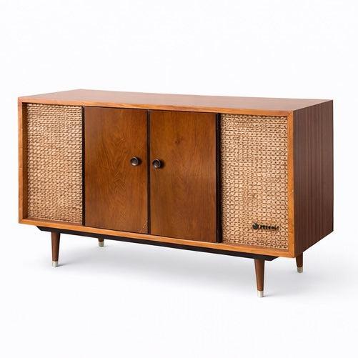 A beautifully proportioned mid-century stereo radiogram by Pye , combining warm teak cabinetry with woven speaker grilles...