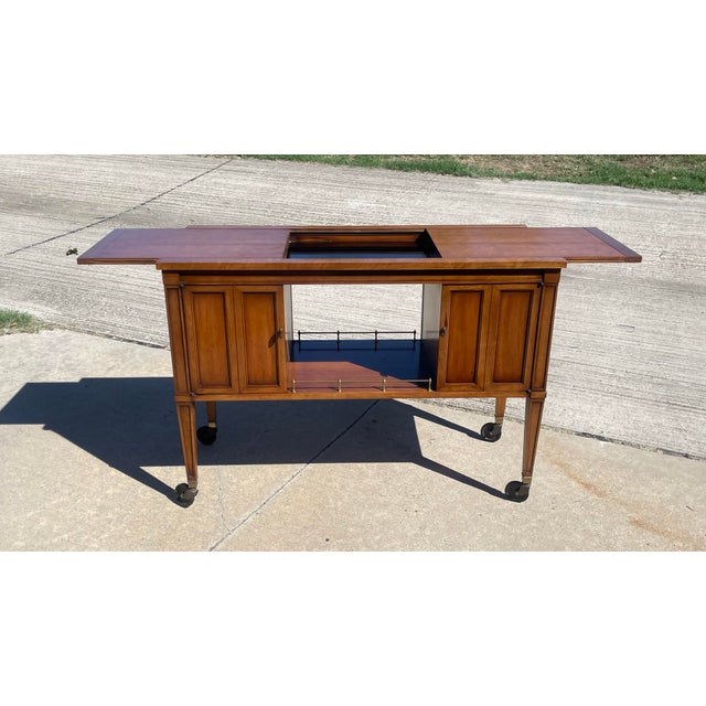 Vintage Drexel Furniture Co rolling dry bar from the Drexel Heritage Palazzo line, circa 1960s. The cherry wood has aged...