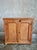 This antique French pine cupboard dates from the early 20th century and is crafted from pine wood. The cabinet features...