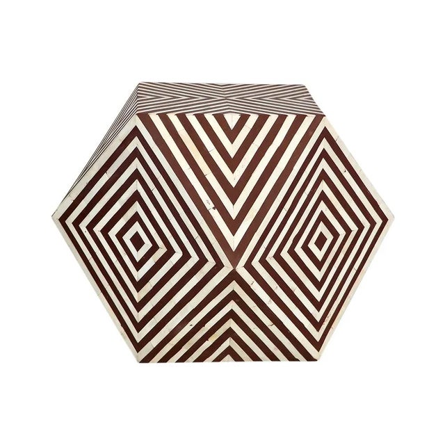 Contemporary and functional, this diamond table features a bone-inlaid, geometric pattern on medium-density fiberboard....