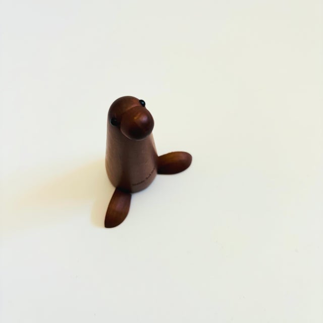 A mid century turned wood figurine in the shape of a Sea Lion. Adorable stylized features. Made in Japan by Senshukai as...