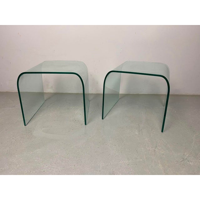 Elegant in their simplicity, this refined mid-century pair of ‘Waterfall’ side tables, designed by Angelo Cortesi for FIAM...