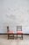 Set of six wooden chairs dating from the mid-20th century. The wooden frames feature turned legs and decorative details,...