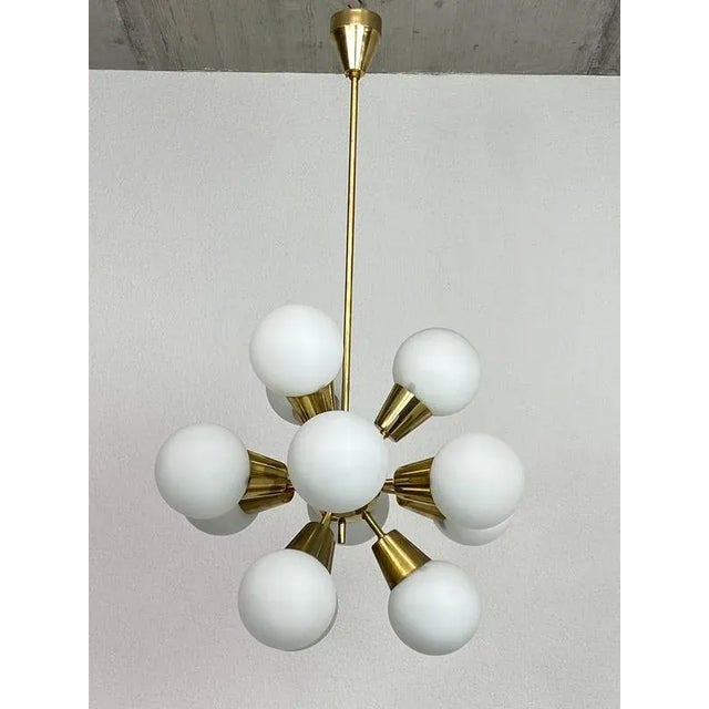 Mid-century modern Sputnik chandelier by Lustry Kamencký Šenov in very nice original condition. This piece is attributed...