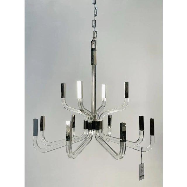 The Reagan chandelier from visual comfort signature, formerly known as Visual Comfort, is a sweeping modern construction...