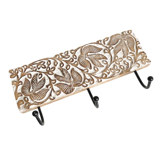 Enhance your home decor with the White Washed Carved Mango Wood 3 Hook Wall Rack, a perfect blend of functionality and...