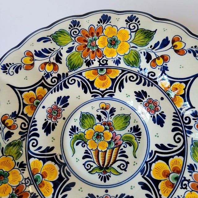 Vintage Royal Goedewaagen Dutch Delft polychrome charger bowl, hand-painted in Holland with colorful floral decoration in...