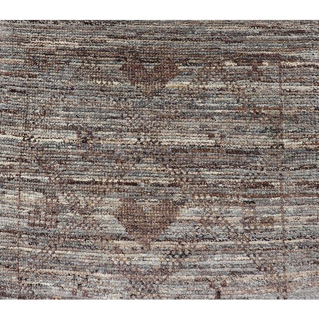 Measures: 3'0 x 11'4. This modern casual tribal runner has been hand-knotted in wool. The runner features a modern all-...