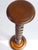 A tall vintage wooden pedestal with a barley twist column. It has a round top and a carved base. Beautiful pedestal/side...