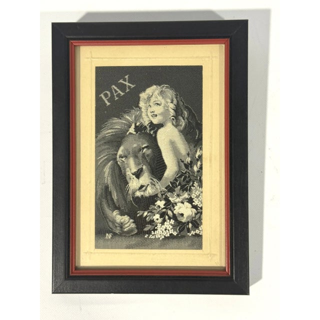 The sweetest woven silk artwork featuring a child hugging a lion, entitled, "Pax". Signed, "NF" in lower left. Incredible...