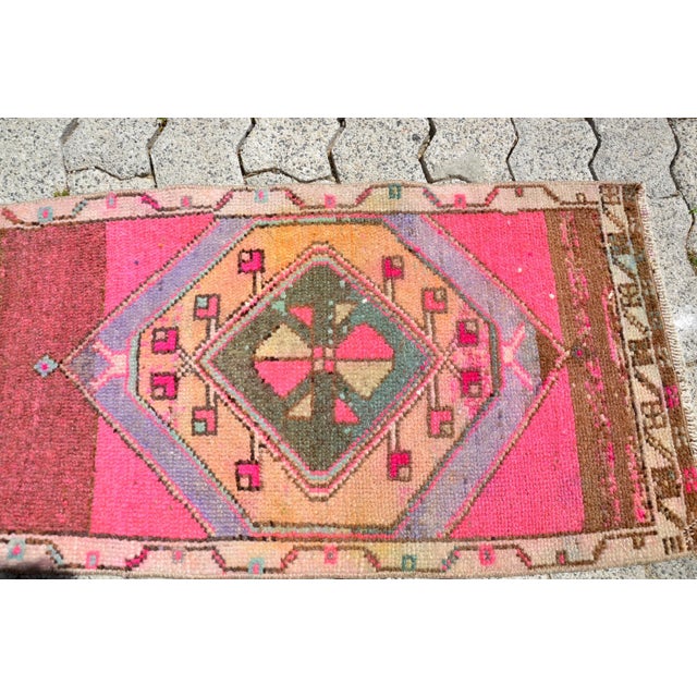 This is a vintage Turkish Oushak rug from the 1960s. The piece was hand-knotted.
