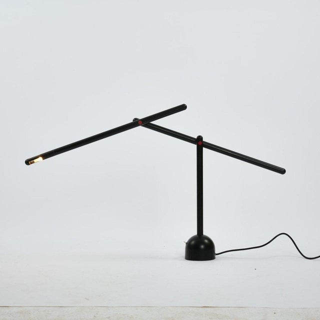 Mira table lights are a work realized by Mario Arnaboldi in 1983. H. 119 cm (max.). Made by Programmaluce, Milan. Metal...