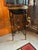 Jardinière plant stand or decorative piece in the neoclassical Egyptian revival style has an iron tripod frame with X-form...