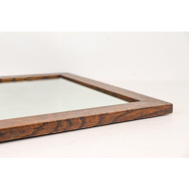 This antique quarter-sawn white oak mirror features the distinctive tiger oak cut pattern, original beveled glass, and...