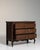 A brown wood, Louis XV-style chest of drawers from the 1800s, made in France. Crafted in wood, the piece retains its...