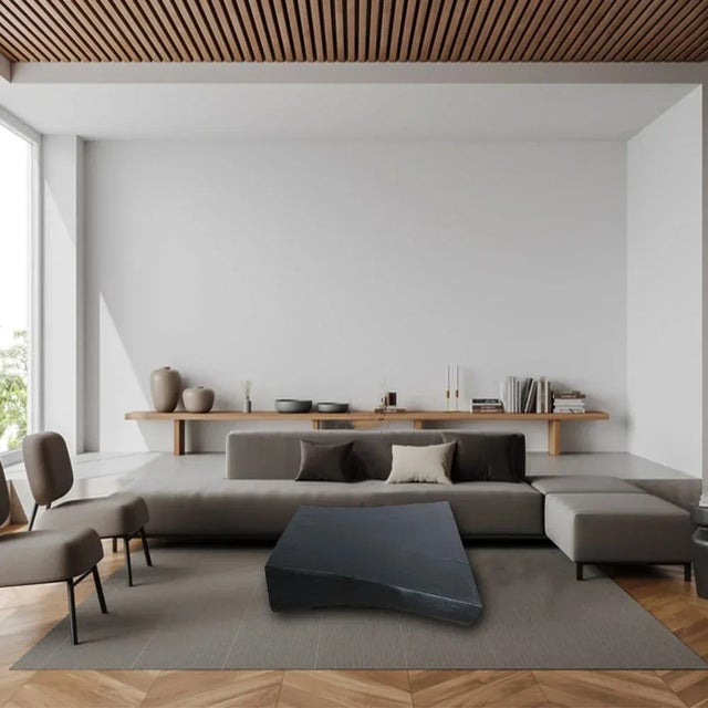 Crafted from a single block of suar wood, this table showcases smooth, curved edges that have been expertly flattened,...