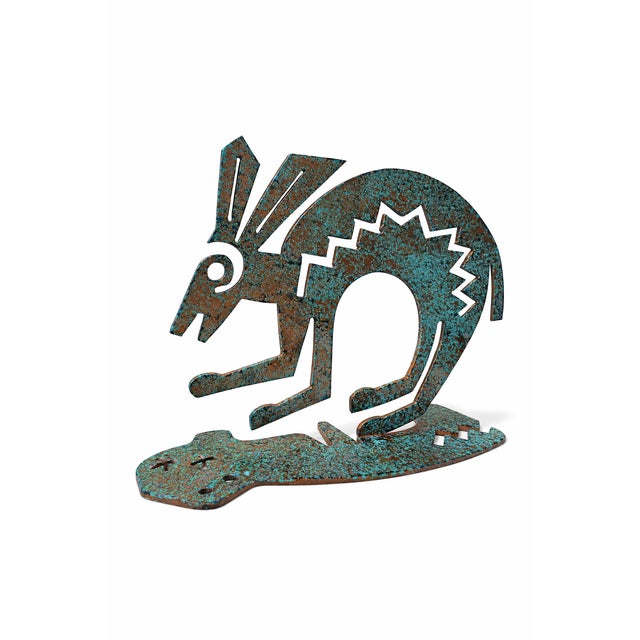 This unique Kokopelli-style metal sculpture captures the spirit of Southwestern design with its rich, hand-applied patina...